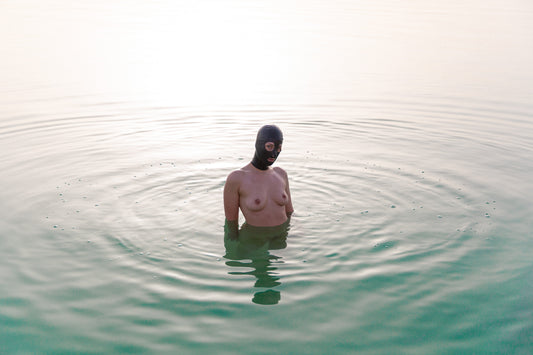 EDITIONS #3 | Human Nature: Noa wearing a latex hood at the Dead Sea